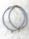 Goupi -  Blue and white necklace shell **